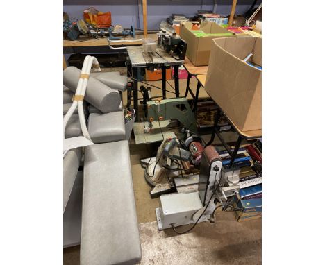 A saw bench, belt sander and other tools