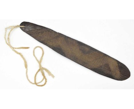 Aboriginal Bullroarer, 19th century, Central Desert of Australia. Carved channeled decoration and pierced at one end. 27cm lo