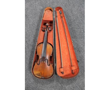 A 19th century continental violin, unmarked, in coffin case with two bows CONDITION REPORT: 14 inch back length, moderate wea