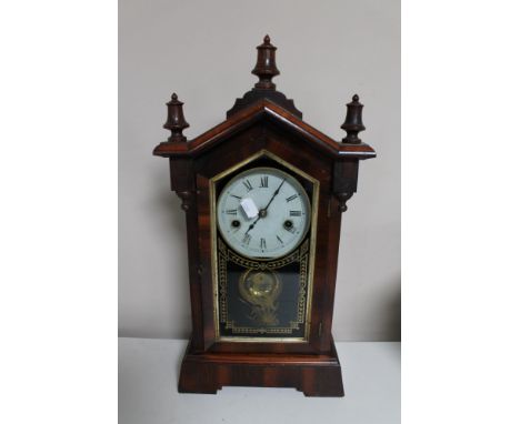 An antique mahogany and pine American style mantel clock 