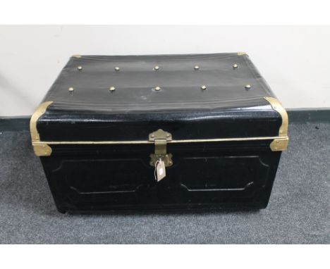 An early 20th century hand painted tin trunk 