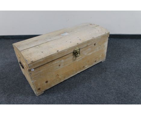An antique pine domed trunk with lion mask handle  CONDITION REPORT: height 41cm width 93cm depth 48cm