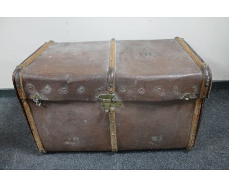 An antique bentwood bound travelling trunk 