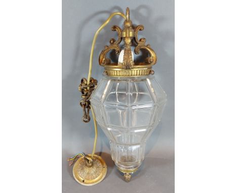 An early 20th Century glass and brass light fitting in the form of a lantern, 40cms long 
