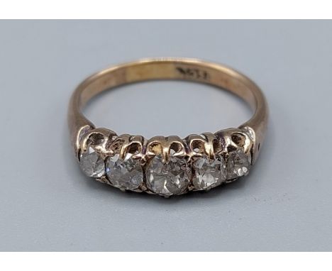 An 15ct gold five stone Diamond ring, the five graduated stones within a pierced setting, 3.8gms, ring size Q 