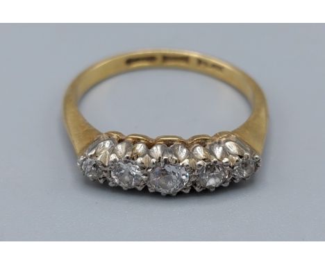 An 18ct gold five stone Diamond ring, claw set, 2.8gms, ring size M 