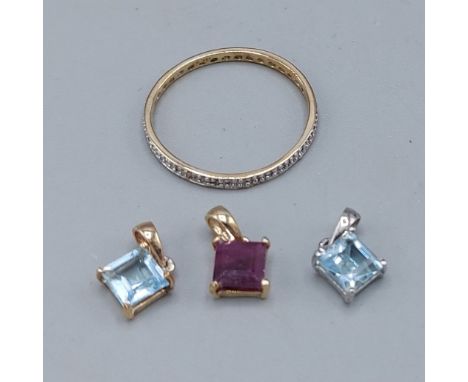 A 10ct gold Diamond set full eternity ring, size O, together with two Topaz set pendants and a Ruby set pendant 