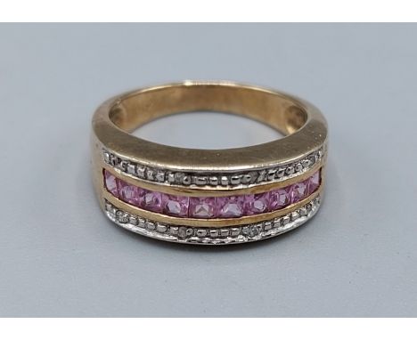 A 9ct gold dress ring set with Diamonds and pink stone, 3.4gms, ring size L 