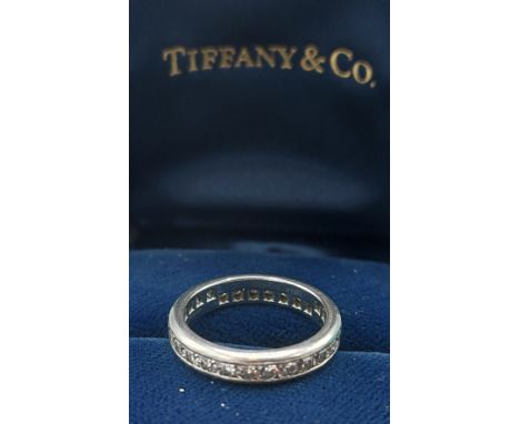 A Tiffany and Co. Lucida Platinum and Diamond set full Eternity ring with ring box and outer box, ring size J, 4.6gms 