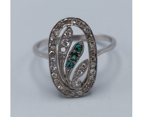 A white metal dress ring set with Diamonds within a pierced setting, (one stone missing), 3.3gms, ring size L 