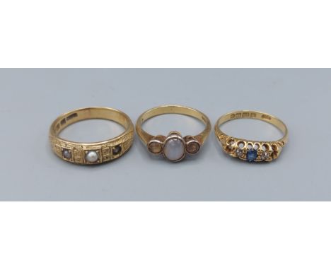 An 18ct gold ring set with a Moonstone together with two other 18ct gold dress rings, 9.9gms 