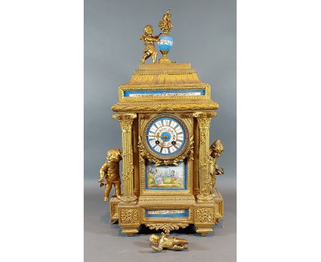 A 19th Century French gilded spelter and porcelain mantle clock, the painted dial with two train movement and with porcelain 