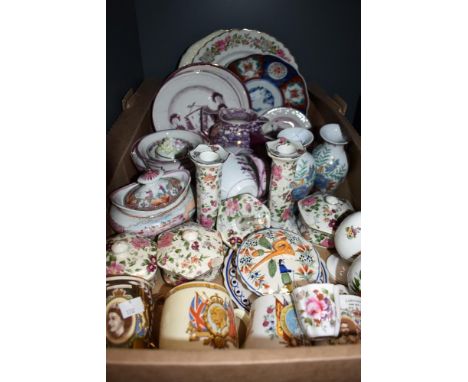 Two Crown Staffordshire ceramic eggs one featuring sprigs of summer flowers and the other showing Christmas flowers and candl