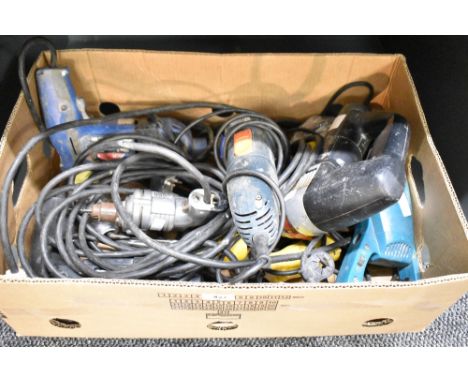 A carton of assorted electric power tools including a Black &amp; Decker Angle Grinder, an Atlas Copco Power Saw, a Makita Ha