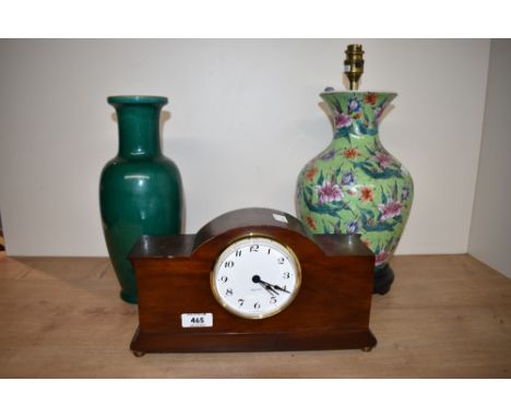 A Chinese style table lamp having multi-coloured lily design on a lime green ground, a green crackle glaze vase and a Quartz 
