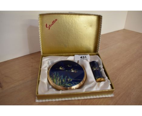 A vintage Stratton powder compact set with matching lipstick holder in original box and featuring flying ducks over a reed be