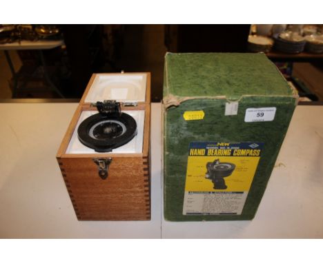 A hand bearing compass in original box 