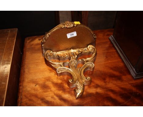 A small gilded wall bracket 