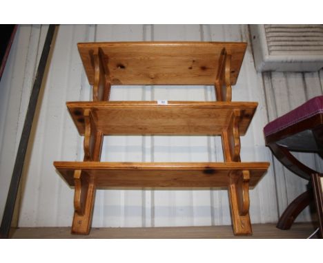 A pine three tier wall shelf 