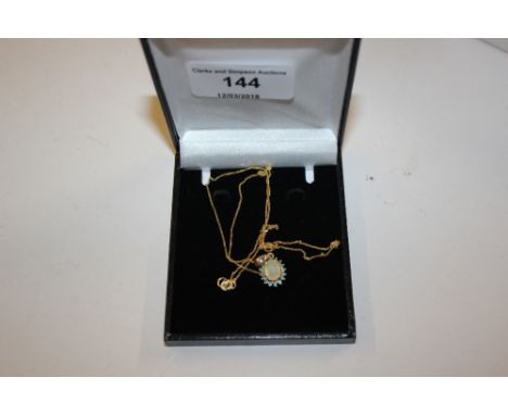 A 10ct gold opal set pendant hung to a 10ct gold chain 