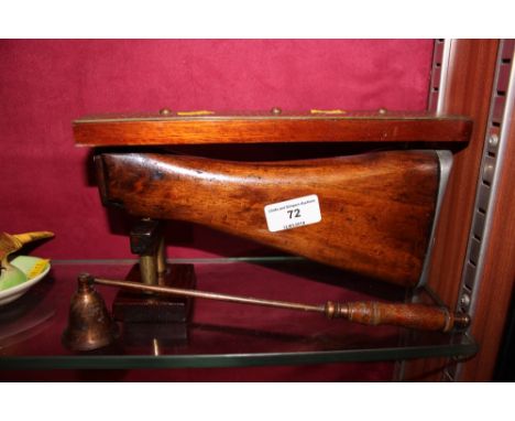 A novelty cribbage board; and a candle snuffer 