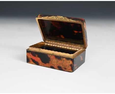 A nineteenth-century tortoiseshell snuff box, of rectangular form, with gilt metal mounts, and Rococo style scroll thumbpiece