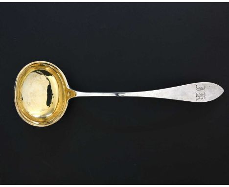 A nineteenth-century Continental silver-coloured metal soup ladle, with gilt bowl, initialled 'JK' or similar, struck with Du