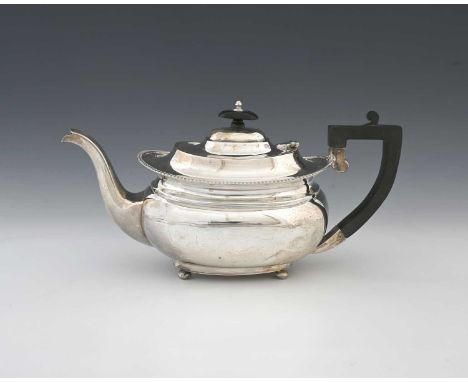 An Elizabeth II silver teapot, of ogee form, with gadrooned border and stepped hinged cover, with ebonised handle and finial,