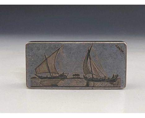 A silver-coloured metal and niello snuff box, of rectangular form, decorated with sailboats and camels, with hinged cover, ap