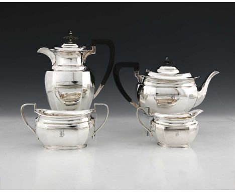 A George V silver four-piece tea service, comprising teapot, and hot water pot, each with ebonised handle and finial, togethe