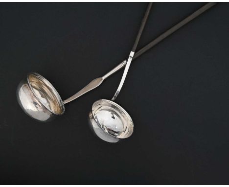 A silver-coloured metal punch ladle, the bowl inset with a William and Mary shilling, with twisted baleen handle, initialled 