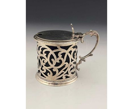 A Victorian silver mustard pot, of drum form, with pierced scroll body, ensuite with blue glass liner, John Keith, London 186