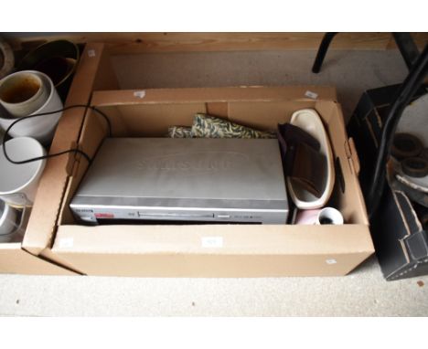 A Samsung DVD/VCD/CD/MP3 player, a small ceramic bedside table lamp, a metal money boxand a washable table cover etc.