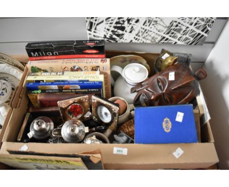A miscellaneous selection of items including a silver plated tea set, two ceramic beer tankards, a tribal mask, an agate elep