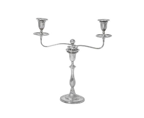 A George III Silver Two-Light Candelabrum,  by Luke Proctor and Co., Sheffield, Circa 1790 the part-fluted circular base with