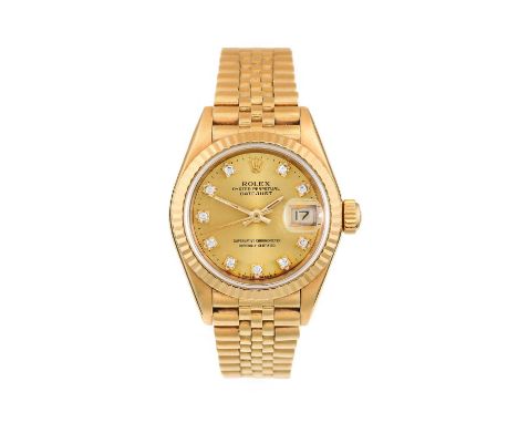 Rolex: A Lady's 18 Carat Gold Automatic Calendar Centre Seconds Wristwatch with Diamond Set Dial Hour Markers, signed Rolex, 