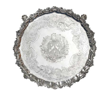 A George II Irish Silver Salver,  Maker's Mark HC, Dublin, Circa 1740 shaped circular and on four shell and scroll cast feet,