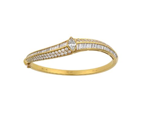 A Diamond Bangle, by Kutchinskythe central marquise cut diamond to a curved bangle set with opposing rows of round brilliant 