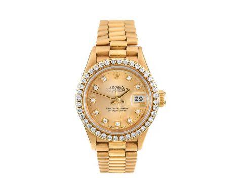 Rolex: A Lady's 18 Carat Gold Automatic Calendar Centre Seconds Diamond Set Wristwatch, signed Rolex, Oyster Perpetual, Super
