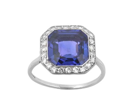 A Colour-Change Sapphire and Diamond Cluster Ringthe octagonal step cut sapphire within a border of eight-cut diamonds in whi