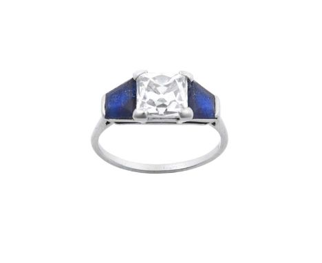 An Art Deco Diamond and Sapphire Three Stone Ring the French cut diamond flanked by a trapezium cut sapphire to each shoulder