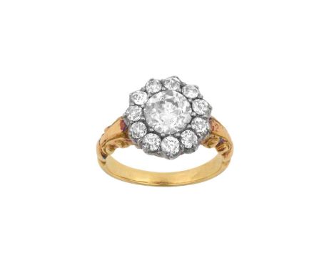 A Diamond Cluster Ringthe old cut diamond within a border of smaller old cut diamonds, in white claw settings, to a yellow tr