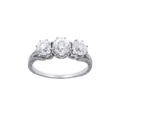 A Diamond Three Stone Ringthe graduated old cut diamonds in white claw settings, to an engraved forked shoulder shank, total 