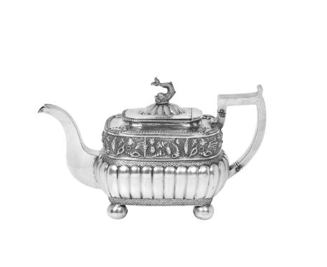 A George III Irish Silver Teapot,  by Christopher Haines, Dublin, 1811  oblong and with lobed lower body, on four ball feet, 