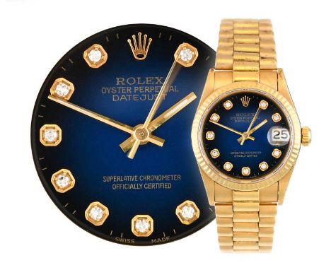 Rolex: A Lady's 18 Carat Gold Automatic Calendar Centre Seconds Wristwatch with an Unusual Blue/Black Ombre Diamond Set Hour 