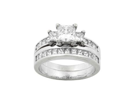 A Diamond Three Stone Ring and A Diamond Half Hoop Ringthe graduated princess cut diamonds in white claw settings, to princes