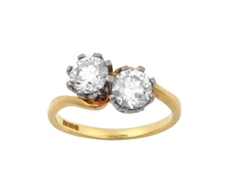 An 18 Carat Gold Diamond Two Stone Ringthe round brilliant cut diamonds in white claw settings, to a yellow twist shoulder pl