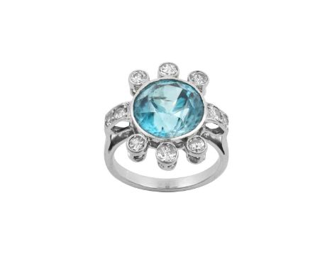 A Blue Zircon and Diamond Ringthe round cut blue zircon with round brilliant cut diamonds at six points, to round brilliant c