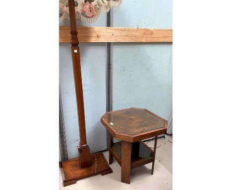 An Art Deco walnut coffee table, the top with canted edges, shelf below; an Art Deco lamp on stepped base 