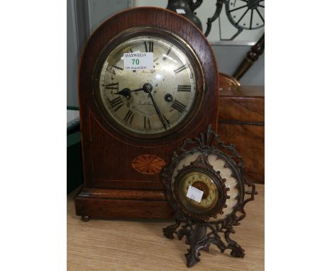 An Edwardian chiming mantel clock in Sheraton style arch top case; a French small bronzed mantel clock 